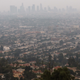The downtown skyline partially obscured by smoke from wildfires after sunset on September 13, 2020 in Los Angeles, California.